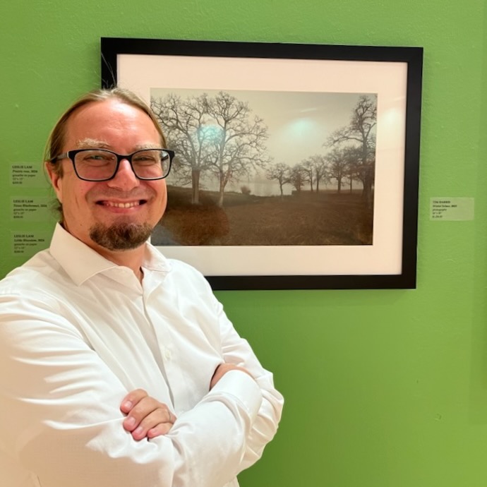 Tim Harris portrait in front of landscape photography